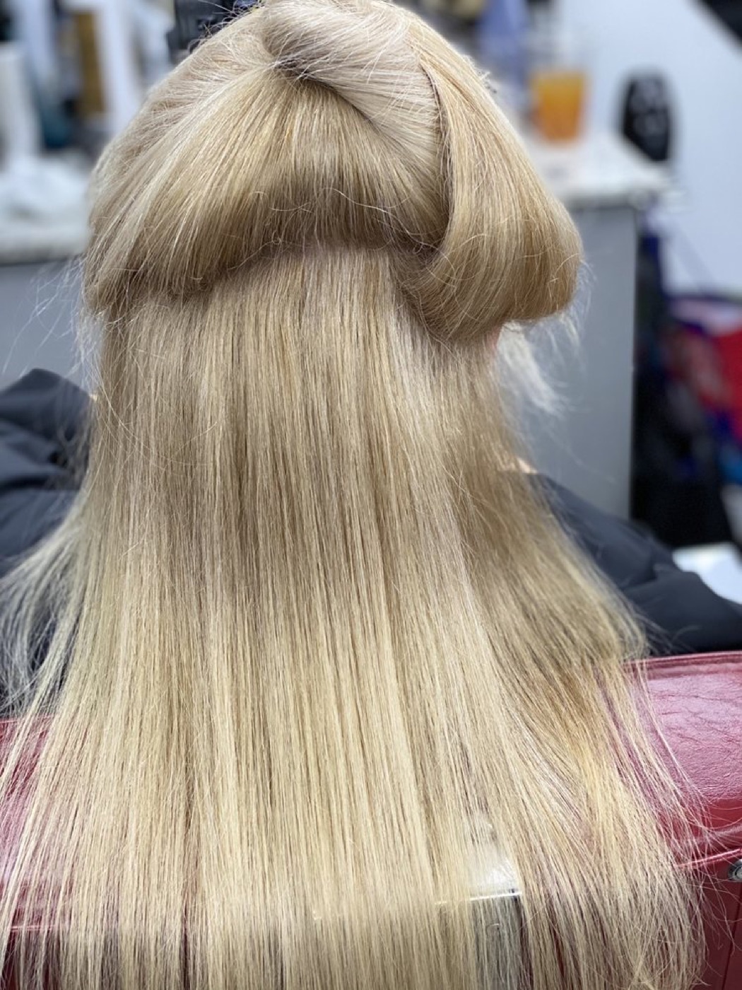 Long, freshly toned platinum blonde hair from behind