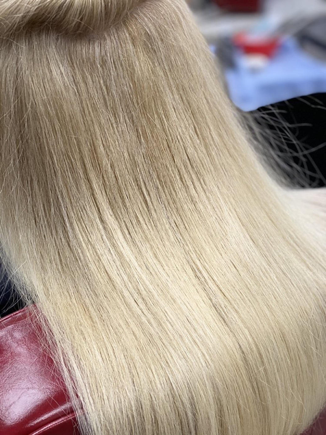 Close-up of long platinum blonde hair after toning