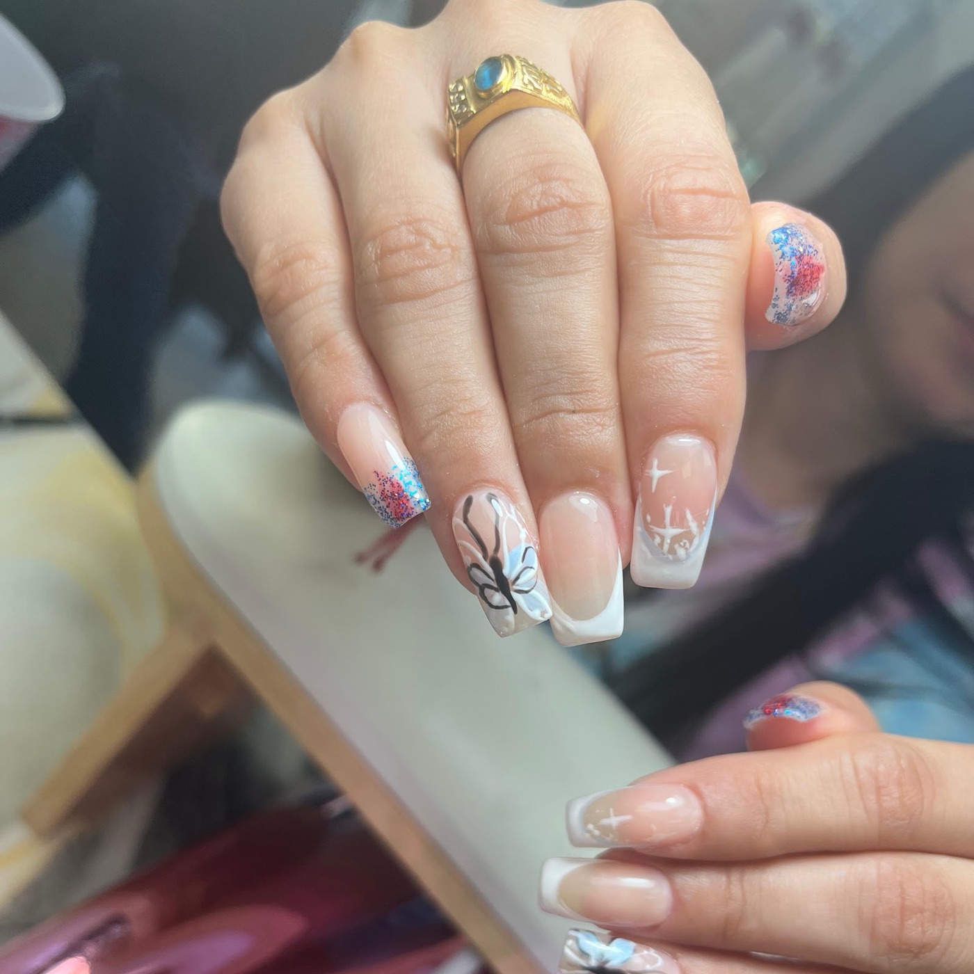 Pastel nail art with tiny painted flowers